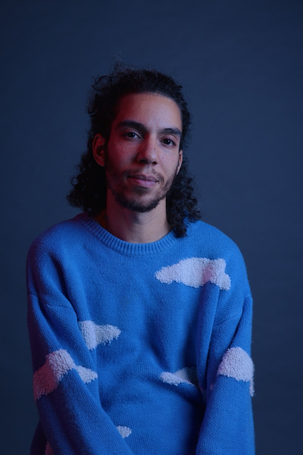 Alkiviades Makrygiannis in blue and red studio lighting